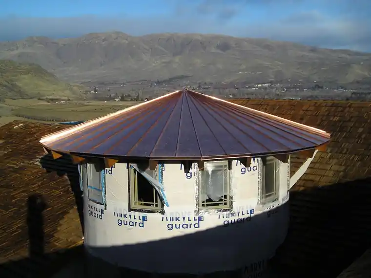 Copper turret roof above the Kittitas Valley, hills on the horizon