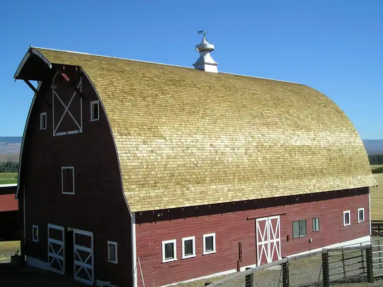 Gambrel barn with a new cedar shake roof