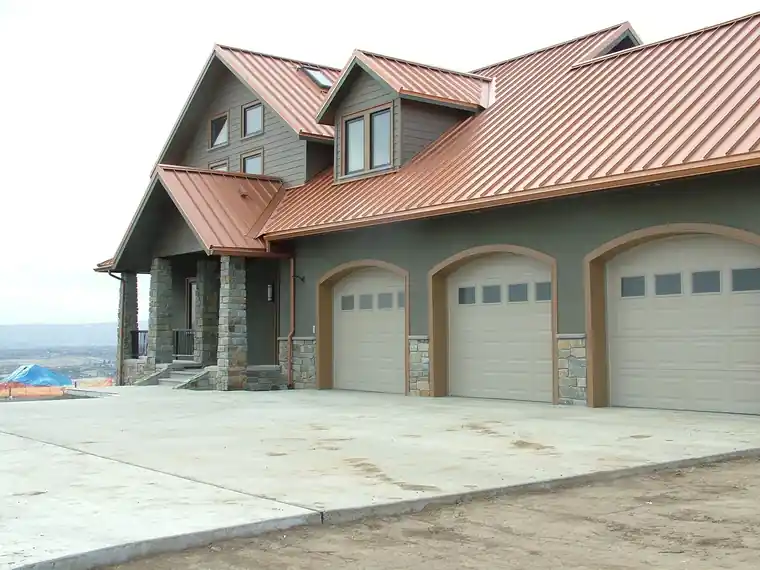 Copper metal roof over a three-car garage