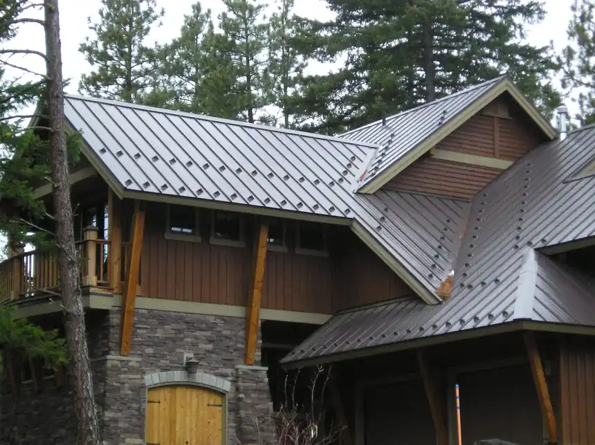 Metal roof lodge on a stone base