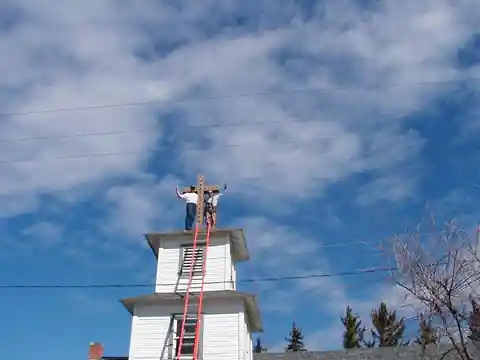 Crew working on a white steeple