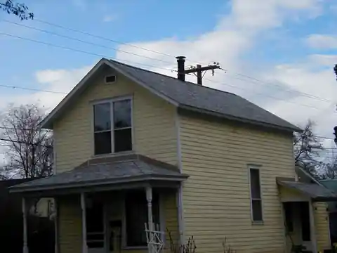 Yellow farmhouse with a fresh roof